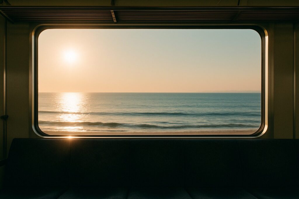 江ノ島ひとり旅を決めた理由|不安障害持ちがGWに出かけようと思ったきっかけ電車の窓から朝日と海が見える画像です。